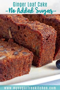 a close up of some brownies on a plate with blueberries next to it