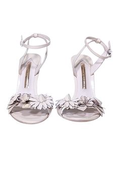 Bring some flower power to your feet with these ethereal pumps from Sophia Webster! Made with gorgeous floral appliques, these strappy beauties are perfect for a swanky springtime soiree. Pair with a floral dress and sparkly clutch for a fresh and feminine look. Size 7.5 (EU 38) Leather upper w/ strappy design Floral appliques on the toe strap Ankle strap closure Skinny heel Leather sole and footbed with some wear Heel 4.5" Floral Print Flower Heels For Spring, Elegant Floral Print Open Heel Sandals, Elegant Flower-shaped Sandals With Heel Strap, Floral Print Heels For Summer Wedding, Feminine Leather Heels For Spring, Summer Wedding Heels With Floral Print, Formal Floral Print Sandals For Spring, Spring Floral Print Leather Heels, Elegant Ankle Strap Heels With Floral Print