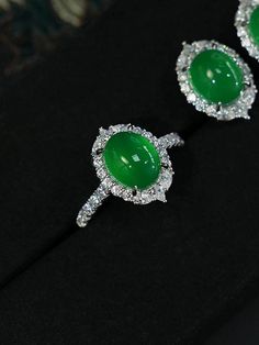 High end lush green Brazilian icy chrysoprase jewelry set. close resemblance to high end jadeite jade, imperial jadeite main stone: 5A high glow Lush green chrome chrysoprase.   side stone: 6A diamond stimulant with genuine diamond coating metal: 18K white gold 5X plated solid S925 sterling silver, double seal the bottoms of the stone to enhance its glow and thickness.  earrings setting size: 17x11.5mm Weight: 2.8g/ each  ring setting size: 17x11.5mm Weight: 4.8g Formal Green Oval Cabochon Jewelry, Exquisite Oval Green Jewelry, Fine Jewelry Green Oval Cabochon, Elegant Emerald Jade Ring With Cabochon, Green Chrysoprase Fine Jewelry, Oval Green Tsavorite Jewelry, Fine Jewelry Green Chrysoprase, Fine Jewelry In Green Chrysoprase, Exquisite Green Cabochon Jewelry