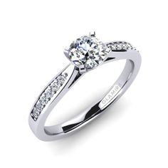 a white gold engagement ring with diamonds on the side