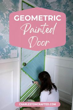 a girl is painting the wall in her room with pink and blue flowers on it