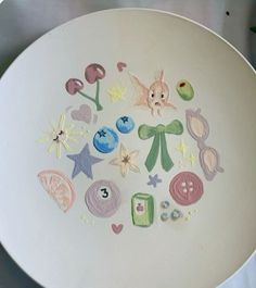 a white plate with different designs on it