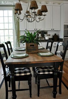 a dining room table with place settings on it