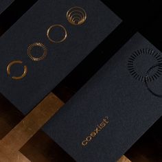 three black cards with gold foil on them and the word gox written in it