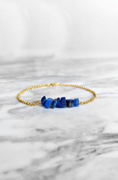 Maat. Inspired by the ancient egyptian goddess Maat. This bracelet is composed of 14K gold vermeil delicate chain and raw lapis lazuli gemstones in royal blue shades. So delicately pretty for everyday! It also makes a very cute gift! Available in: ❉ 14K Yellow Gold vermeil ❉ 14K Rose Gold vermeil ❉ 925 Sterling Silver You can choose between 6 chain lengths: 5.5 / 6 / 6.5 / 7 / 7.5 / 8 inches Not sure which length to buy? We can add a 1 inch extender chain. Just write a note at checkout! ❈ We sen Goddess Maat, Raw Lapis Lazuli, Ancient Egyptian Goddess, Lapis Lazuli Bracelet, Egyptian Goddess, January Birthstone, Delicate Chain, Chain Gold, Delicate Jewelry