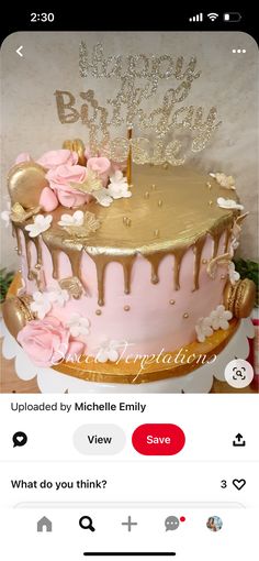 a pink and gold birthday cake with flowers on it