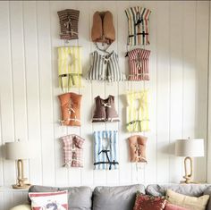 a living room filled with furniture and lots of pillows