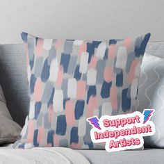 a pillow with the words support independent artists on it