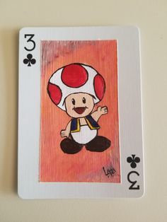 a playing card with an image of a mushroom on it