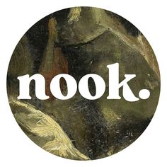 the words nook are in white letters on a black circle