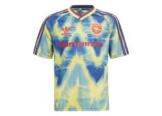 a blue and yellow tie - dye shirt with the word, manchester on it