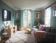 a living room filled with furniture and windows