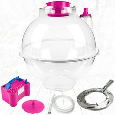 a plastic tea pot with accessories for making it