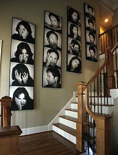 a staircase with multiple pictures on the wall