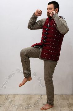 a man is doing an acrobatic move with his feet in the air