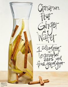 a pitcher filled with cinnamon and apple slices