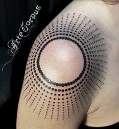 a woman's shoulder with black dots on it and the word, tattoo designs