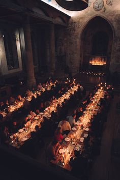 an overhead view of a dining hall with long tables