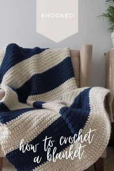 a blue and white blanket sitting on top of a chair