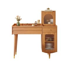 a wooden desk with shelves and drawers on it's sides, next to a potted plant