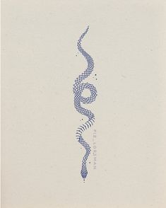 a drawing of a snake on top of a piece of paper