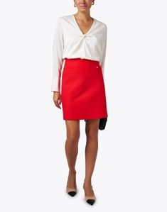 Spice up your wardrobe this season with Marc Cain's striking red mini skirt. Crafted from 100% wool, this slim fit mini silhouette is complete with side pockets and intricate seam detailing. Pair with blouses and knits alike to add a chic base to all your favorite neutral tops. Skirt And Top Dress, Pink Sheath Dress, Swiss Dot Dress, White Silk Blouse, Neutral Tops, Red Mini Skirt, Blue Mini Skirt, Wool Mini Skirt, Modern Wardrobe