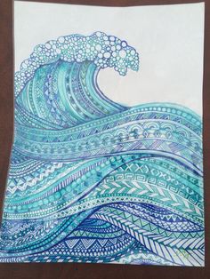 a drawing of a wave in blue and white on a piece of paper that has been drawn