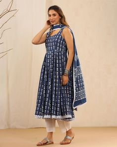 This is a beautiful 3-piece anarkali suit set. The set includes anarkali kurta with 32 kali has square neck, sleeveless & calf length teamed with white solid cotton pants with elasticated waistband and a cotton printed dupatta with lace detailing. 3 piece set Suit Fabric-Cotton Dupatta Fabric-Cotton Length-Calf Length Color - Blue & White Neck-Square Neck Sleeves-Sleeveless Washing Care-Dry Clean or Quick Deep Wash DISCLAIMER - The color of the product may be differ due to screen settings of dev Sleeveless Anarkali Cotton Kurta, Fitted Ankle-length Salwar Kameez With Printed Motifs, Fitted Cotton Anarkali Palazzo Set, Fitted Cotton Anarkali Set, Summer Anarkali Set With Block Print, Summer Anarkali Set With Traditional Drape, Fitted Cotton Anarkali Maxi Set, Cotton Maxi Length Dupatta, Fitted Summer Anarkali Set