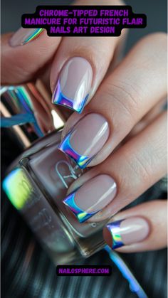 This close-up showcases an ultra-modern twist on the classic French manicure. The nails feature a nude, glossy base, elegantly topped with metallic chrome tips in mesmerizing, shifting iridescent hues. The chrome accents capture light from every angle, creating a dazzling rainbow-like sheen. This manicure perfectly combines subtle elegance with a bold, futuristic edge, ideal for those who want to stay ahead in the fashion game. Iridescent French Tips, Chrome Tipped Nails, Chrome Tips Nails, Iridescent French Tip Nails, Chrome Nails Designs French, Chrome French Manicure, French Nails Chrome, Futuristic Nail Art, Chrome Nails French Tip