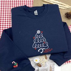 christmas shirt, christmas pullover, christmas sweatshirt, christmas trees, christmas tree shirt, holiday sweatshirts, tree picking shirt, christmas sweater, christmas crewneck, xmas sweatshirt, christmas tree, for women, womens christmas 🎆 PRODUCT AND BRAND: ➤ Gildan ® brand ➤ Unisex & Classic fit ➤ 8 oz./yd² (US) 13.3 oz./L yd (CA), 50/50 cotton/polyester, 20 singles - Heather Sport colors are 60/40 polyester/cotton - Safety Green is compliant with ANSI / ISEA 107 high-visibility standards - 1x1 rib with spandex for enhanced stretch and recovery - Tear away label - Proud member of the U.S. Cotton Trust Protocol   🎆 STORE INFORMATION: ➤ Design proof (for customized products or if you request): 1- 2 business days (simple embroidered products) | 2 - 3 days (for fully embroidered products) Holiday Sweatshirts, Embroidered Products, Christmas Tree Embroidery, Christmas Pullover, Tree Embroidery, Womens Christmas, Trees Christmas, Christmas Tree Shirt, Christmas Crewneck