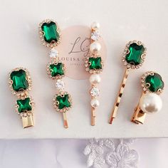 Louisa Grace Jewellery. For the bride of today and the heirlooms of tomorrow.  Bride and bridesmaid set of five hair clips, all hair clips are different styles, each one has crystal emeralds framed in clear crystals and two have creamy faux pearl detailing, the emeralds on four have an attractive faceted emerald cut, the two smaller of the five are concord clips the rest are bobby pins they are all stunning, gold plated finish. The clips are perfect for brides, bridesmaids or as a pop of colour Vine Headband, Pearl Hair Clips, Emerald Green Crystal, Champagne Earrings, Bridal Jewelery, Wedding Gift Wrapping, Party Hair Accessories, Big Pearl, Pearl Hair Clip