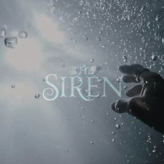 a hand reaching out to the sky with water droplets on it and the words the siren above them