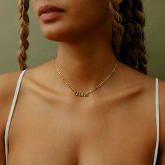 Model is wearing an 14" inch, Cuban chainCustomizable with: Letters, Numbers & Roman Numerals.Chain width:Cuban Chain - 3.7 mm Figaro Chain - 3 mm Rope Chain - 2.3 mm Closure: All chains are fitted with a lobster clasp. Metal Selection:Sterling silver14k gold plated over sterling silver14k Rose gold over sterling silver10k solid gold (NAMEPLATE ONLY)14k solid gold (NAMEPLATE ONLY) Chloe Style, Dainty Initial Necklace, Ring Bracelet Chain, Name Earrings, Engraved Pendant, Nameplate Necklace, Photo Pendant, Wear Necklaces, Cross Chain