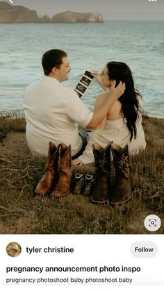 a man and woman sitting on the ground next to each other