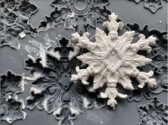 a snowflake that is on the side of a wall in black and white