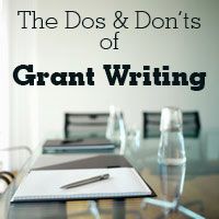 the dos and don'ts of grant writing on a table with glasses, pen and notebook