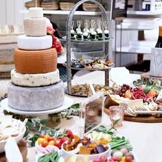 a table topped with lots of different types of cakes and pies on top of plates