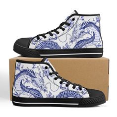 These Blue Dragon Blue Ceramic Black high top canvas shoes are ideal for being unique and standing out from the rest of the crowd. To be Gnarly, you need to be different and feel different. These shoes will help you express yourself through the intricate art and gnarly design it displays. This unique shoe is hand drawn/designed in the USA and built with fantastic quality. CONSTRUCTION: Our shoes are very well constructed with quality stitching and a solid base. They are comfortable and durable and suitable for most occasions. HANDCRAFTED DESIGN: Wearing these shoes is making a statement. Our shoes have bold and gnarly designs that fit anyone who want to separate themselves from the rest. The designs are inspired by art and beauty from around the world. Exclusively designed in the USA. __FE Blue High-top Canvas Shoes, Blue Canvas High-top Sneakers For Streetwear, Blue Canvas High-top Sneakers With Round Toe, Dragon Blue, Unique Shoe, Black High Top Converse, Intricate Art, High Top Converse, Converse Style