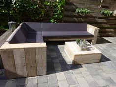 an outdoor seating area with benches and tables