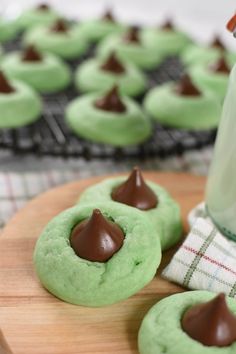 green cookies with chocolate frosting and a bottle of milk