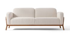 a white couch sitting on top of a wooden frame