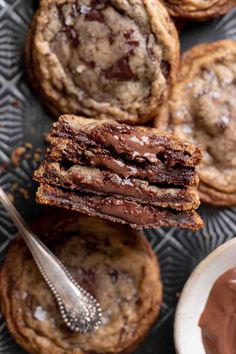 chocolate chip cookies stacked on top of each other with a bite taken out of one