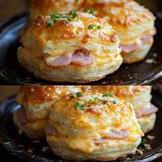 ham and cheese biscuits on a black plate