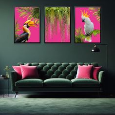 a living room with green couches and pink wall art on the walls, including two toucans