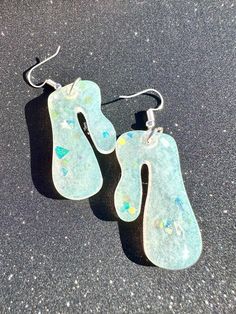 Funky irregular droopy shaped resin earrings. Irridescrnt colored with chunky glitter. one of a kind, handmade Droopy Earrings, Jewelry Earrings Dangle, Dangle Drop Earrings, Glitter, Dangle Earrings, Jewelry Earrings, Gift Card, Etsy Accessories, Accessory Gift