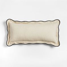 a white and black pillow on a white background with a black border around the edges