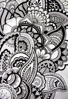 an intricate black and white drawing with lots of doodles on it's surface