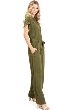 Coverall jumpsuit with short, rolled sleeves and a full length, wide-leg bottom. Button down top with pockets on the sides. Self-tie belt. CARE | Machine Wash ColdCONTENTS | 100% RayonMEASUREMENTS | 59"/150 cm Top to Bottom 30"/76 cm Inseam (Size Small) MODEL | 5'8 - wearing a size SmallIMPORTED Belted Button-up Jumpsuits And Rompers For Spring, Spring Belted Button-up Jumpsuits And Rompers, Spring Button-up Belted Jumpsuits And Rompers, Belted Button-up Jumpsuit For Spring, Chic Short Sleeve Jumpsuits And Rompers With Pockets, Relaxed Fit Jumpsuits And Rompers With Short Sleeves, Summer Workwear Jumpsuits And Rompers With Belted Cuffs, Workwear Wide Leg Belted Jumpsuits And Rompers, Casual Solid Belted Jumpsuits And Rompers