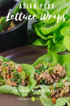 lettuce wraps filled with meat and veggies on top of a plate