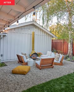 an outdoor patio with chairs and a fire place in the back yard, next to a shed